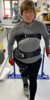Jane walking with the aid of the Carbon Fibre Exoskeleton by Xothotics Thumbnail