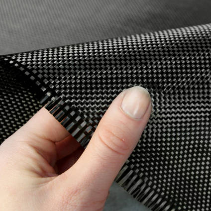 210g Plain Weave 3k Carbon Fiber Cloth In Hand Closeup