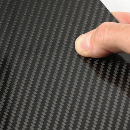 High Strength Carbon Fiber Sheet in Hand Closeup