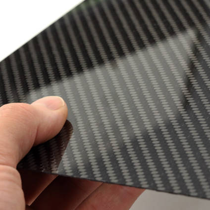 High Strength Carbon Fiber Sheet in Hand with Reflection