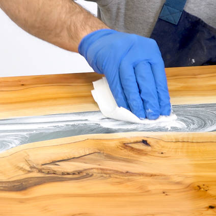 Applying NW1 Polishing Compound to a river table
