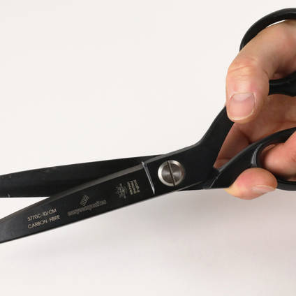 Professional 10 Inch Carbon Fiber Composites Shears in Hands