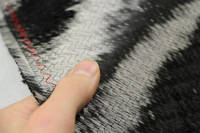 300gsm Biaxial Carbon Fiber Reinforcement, Reverse Side - In Hand Closeup Thumbnail