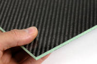 Foam Cored Carbon Fiber Panel in Hand Closeup Thumbnail